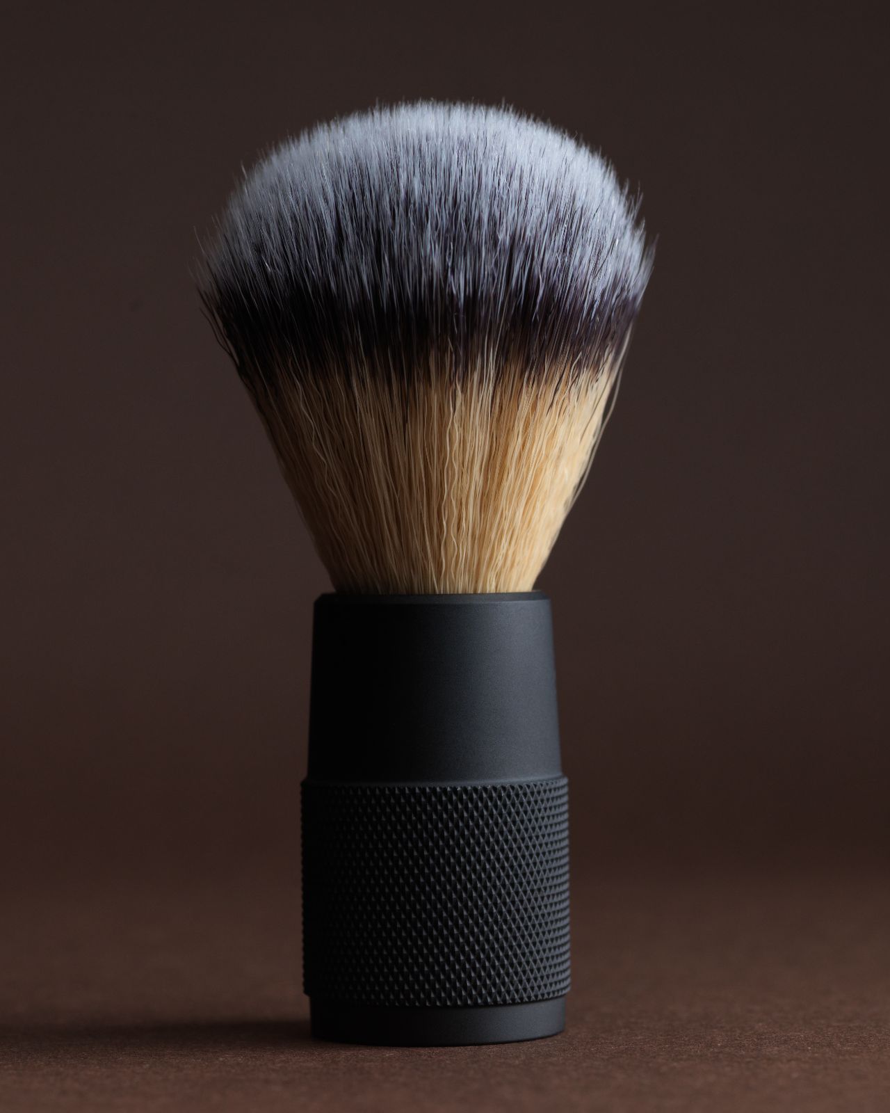 Close up of Apothecary87 shaving brush with soft lighting. Macro close up of the individual bristles.