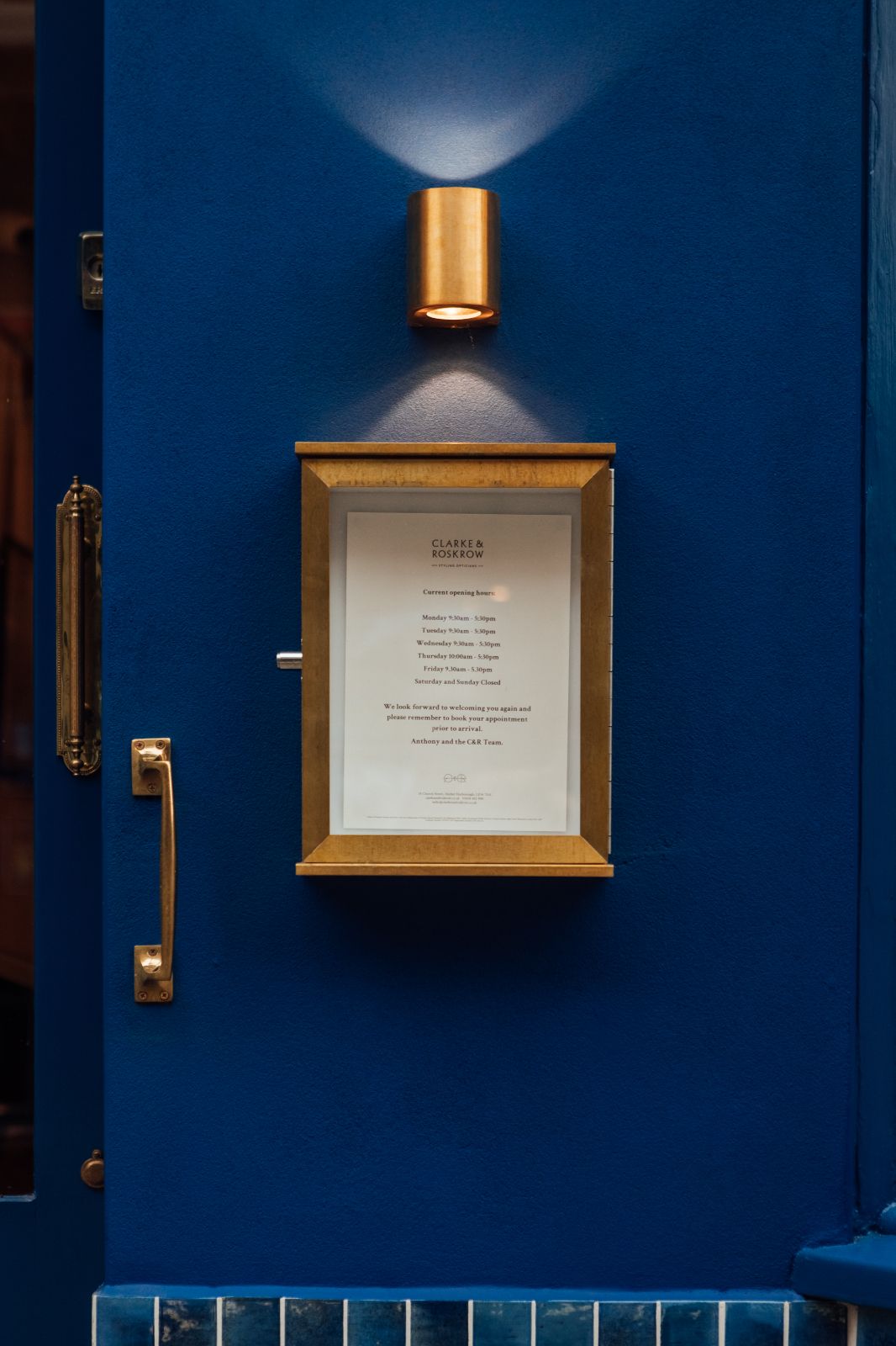 Custom notice box made from brass which sits on the wall beside the front door. Clarke 