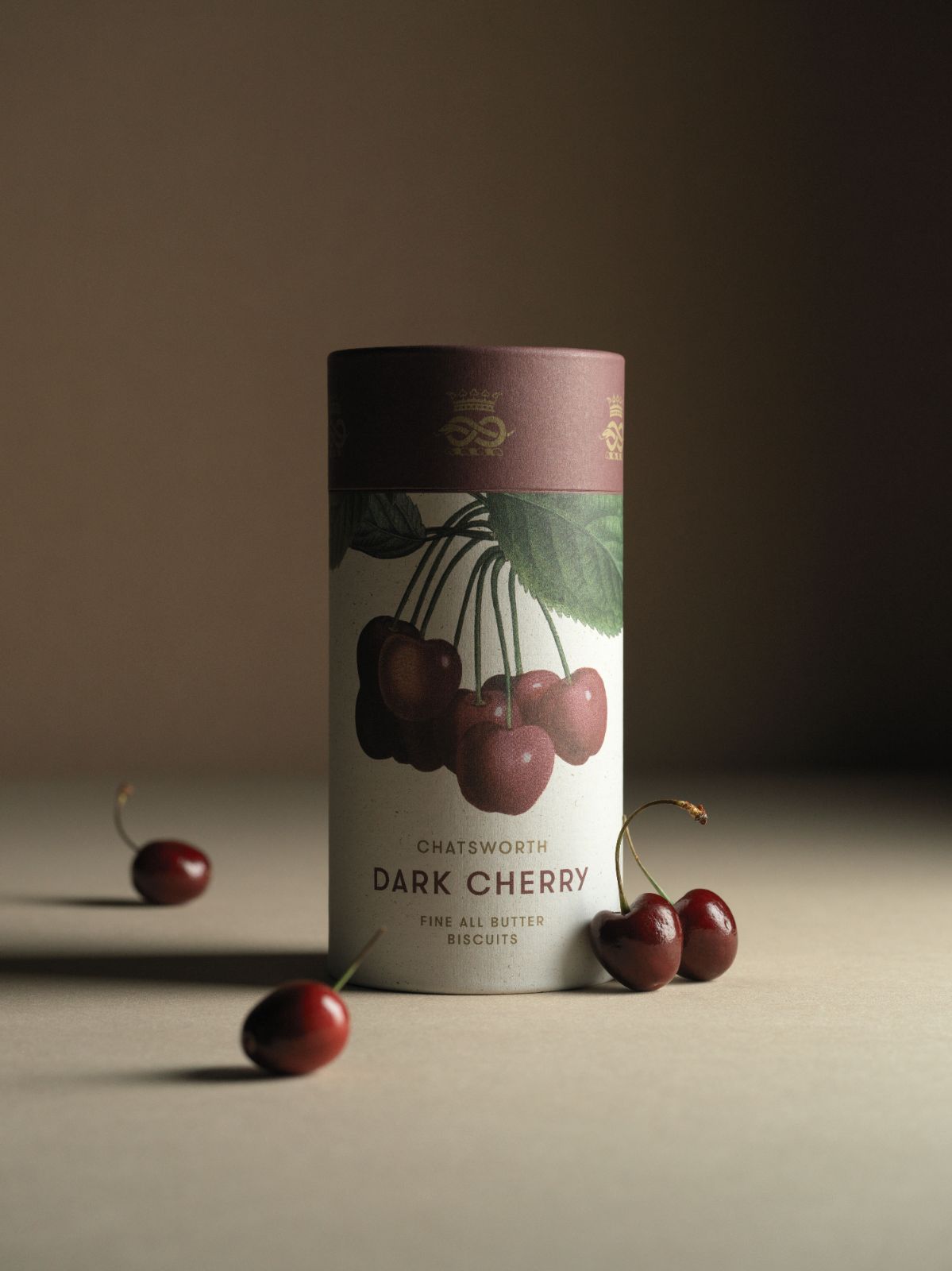 Dark cherry Chatsworth Artisan Biscuits. Vertical packaging with botanical illustrations across the side.