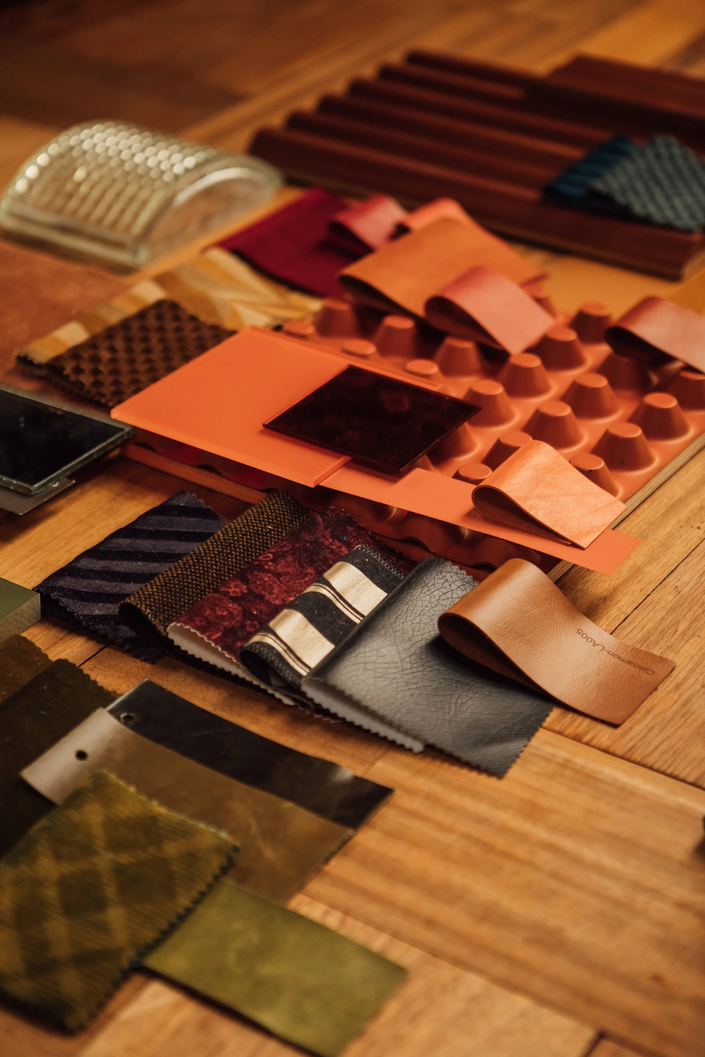 A selection of materials and textile samples on a table