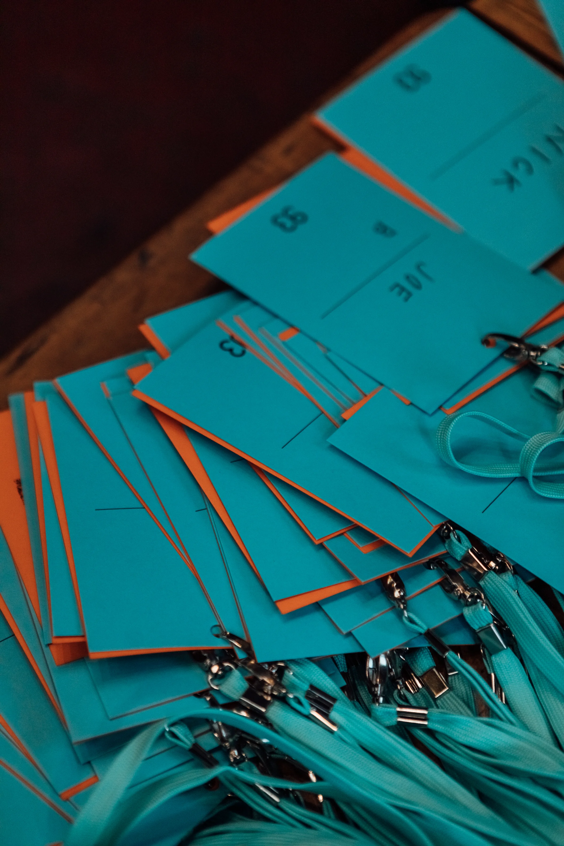 A pile of custom designed and printed GF Smith Colorplan lanyards for the 93 Features Marketing for growth event.