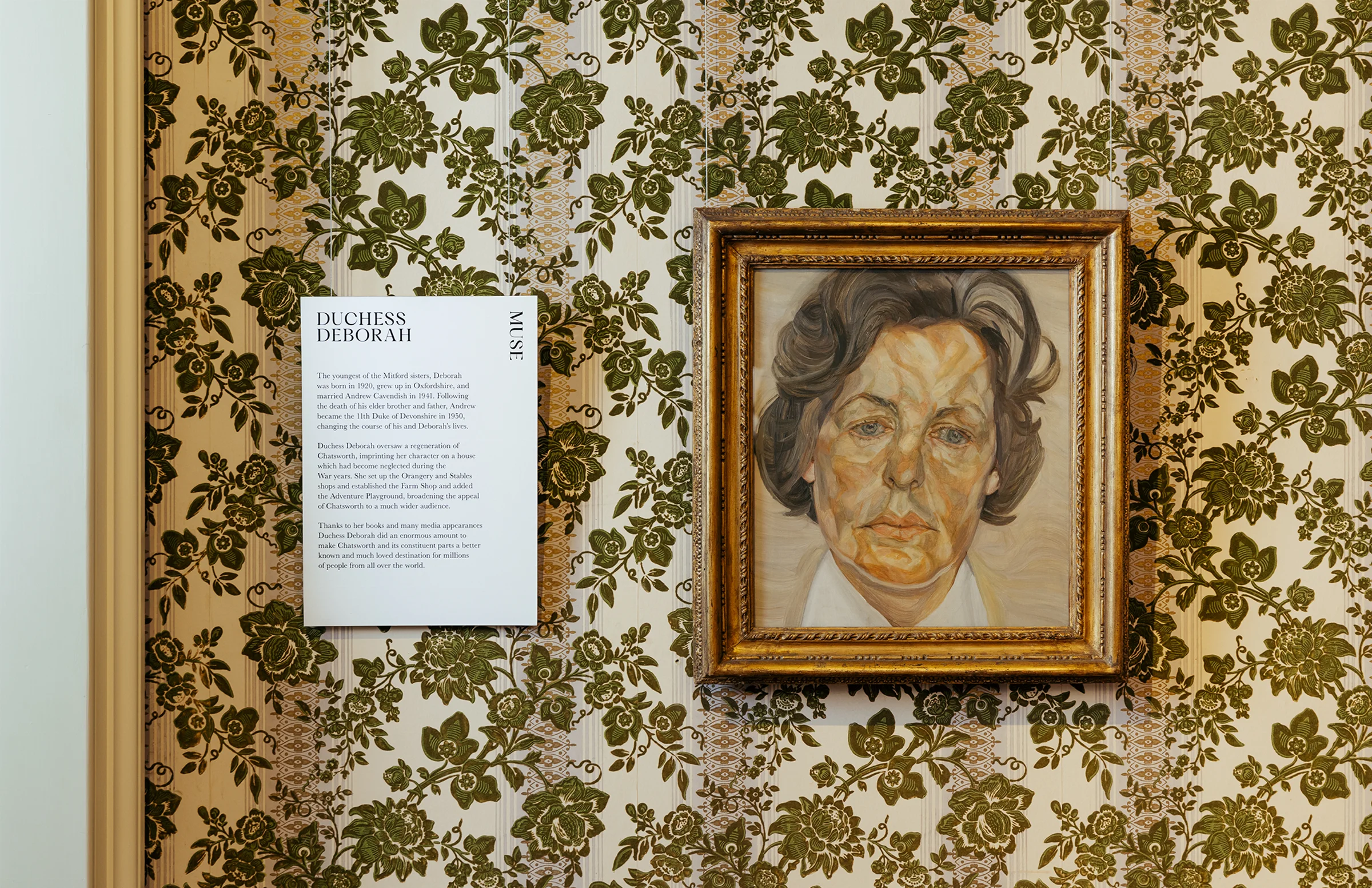Simple exhibition signage next to framed artwork of Duchess