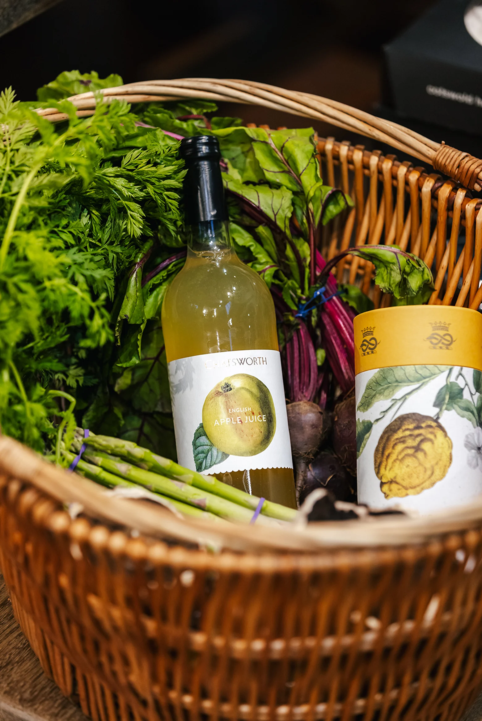 Cloudy apple and coffee products in wicker basket