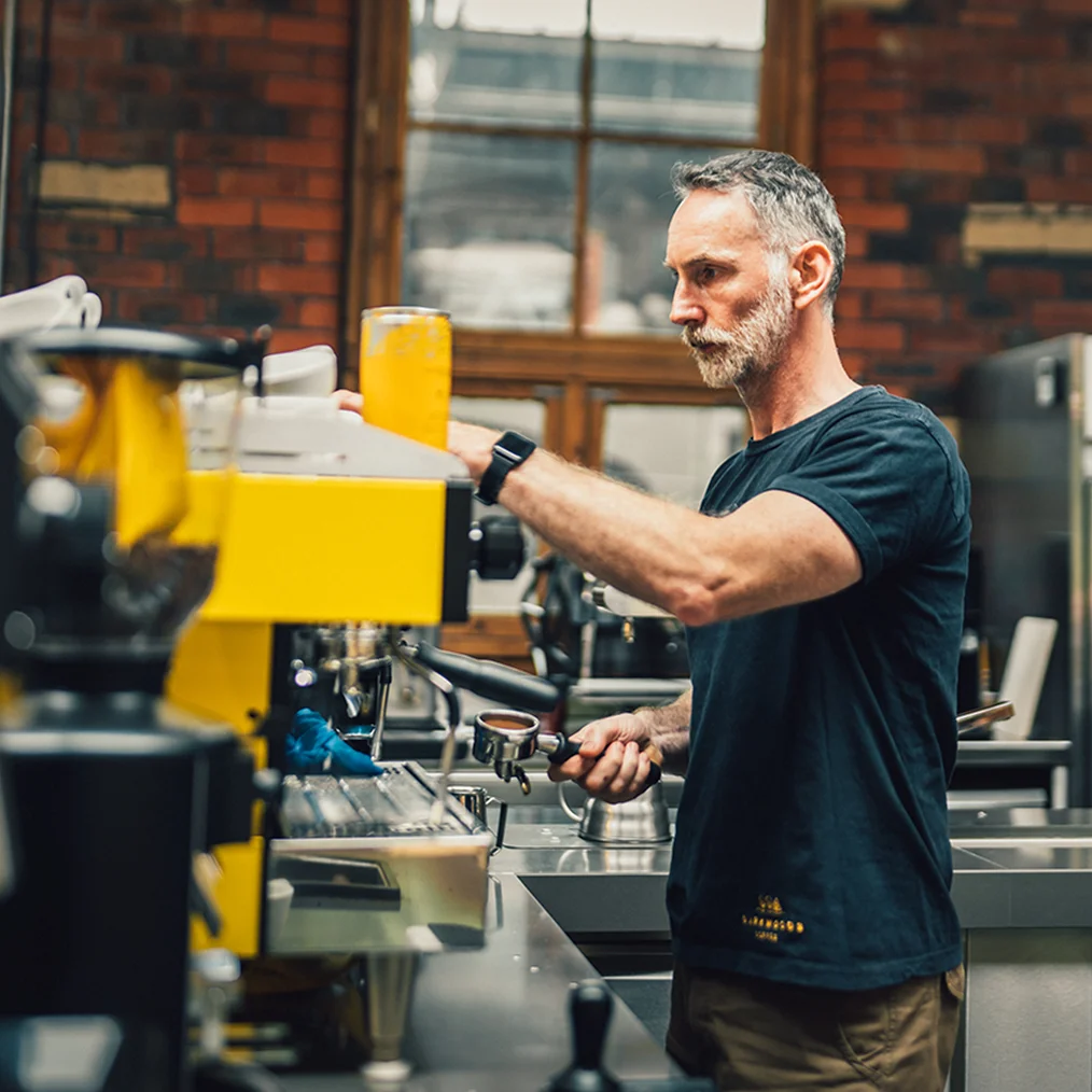 Barista preparing coffee in cafe