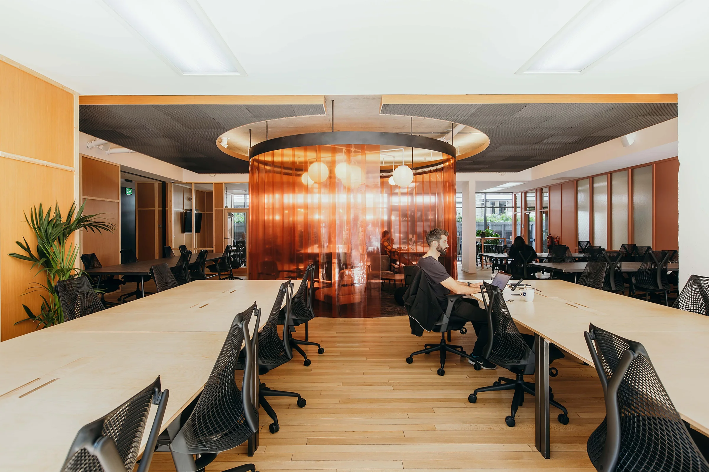 Wide-angle of tnterior co-working desk set-up