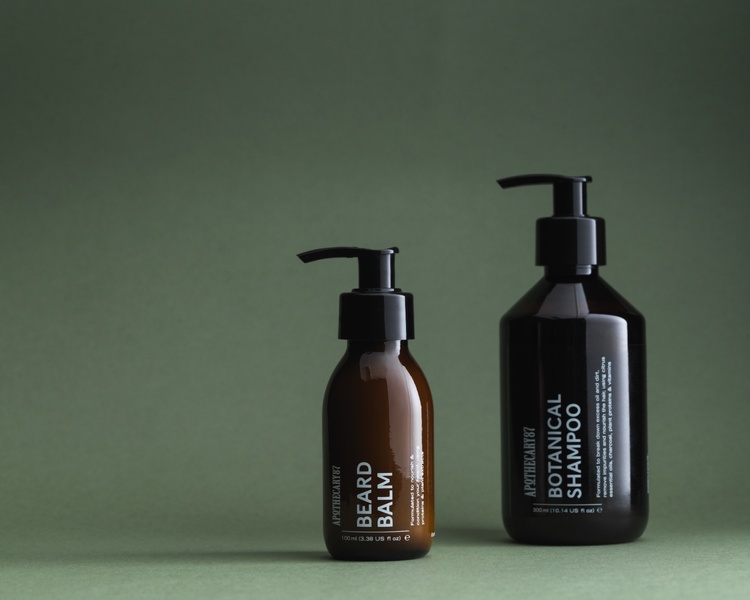 Two natural grooming products by Apothecary 87 Beard Balm, Botanical Shampoo. - branding and packaging design by 93ft Design. 