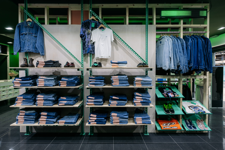 Unistrut shelving system & plywood shelves to display denim jeans & jackets in Glass Onion vintage clothing store